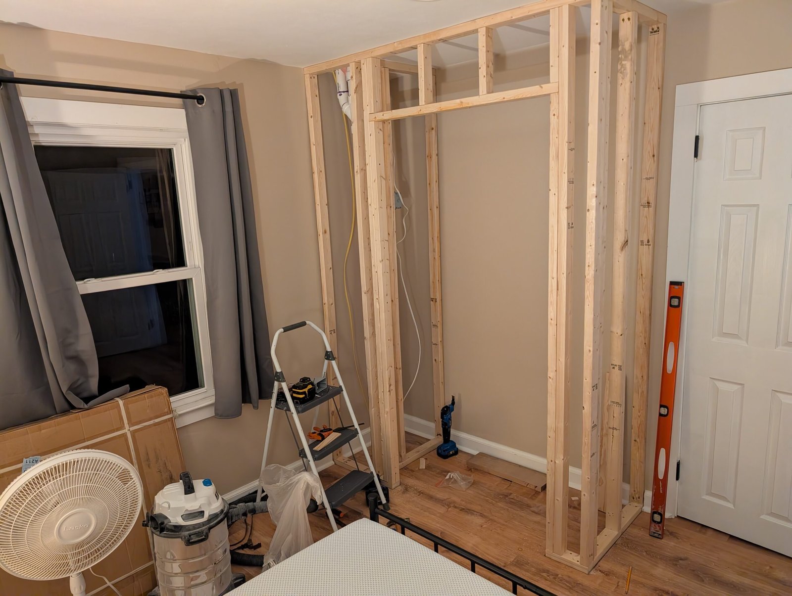 Framing of the closet is complete, showing the full enclosure around the plumbing with solid support