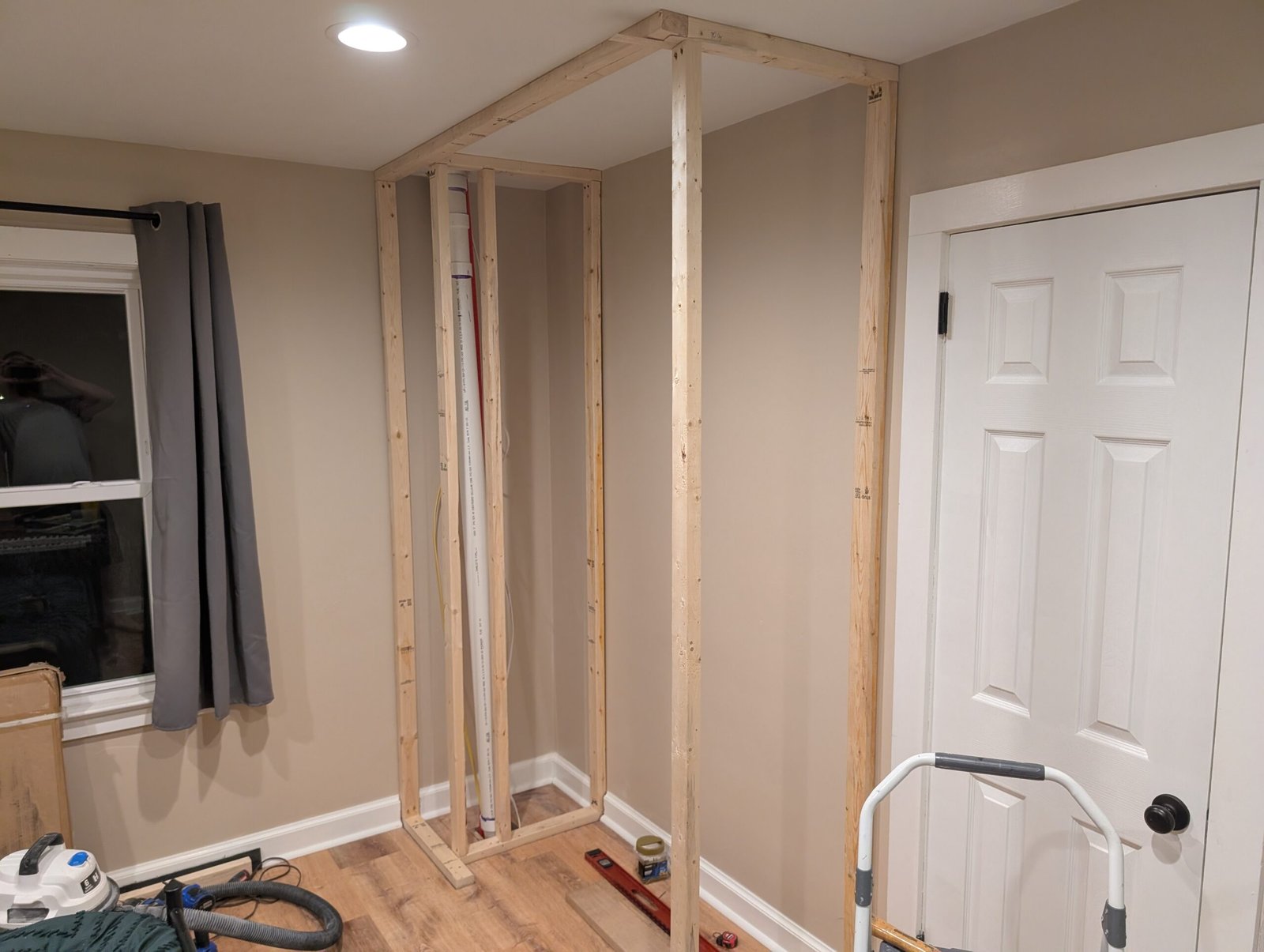 Pipes boxed out and one side of the closet framing started, about 50% complete with the plumbing secured